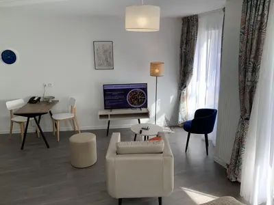 Télévision ou salle de divertissement dans l'établissement Domitys Villa Kera