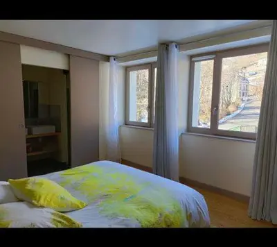 Un ou plusieurs lits dans un hébergement de l'établissement Auberge du Pont