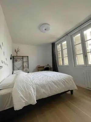 Un ou plusieurs lits dans un hébergement de l'établissement Appartement T2 à centre ville