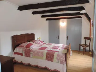 Un ou plusieurs lits dans un hébergement de l'établissement Charmante maison de campagne