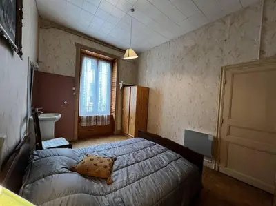 Un ou plusieurs lits dans un hébergement de l'établissement Le nid douillet Rustique Linge fourni