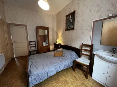 Un ou plusieurs lits dans un hébergement de l'établissement Le nid douillet Rustique Linge fourni