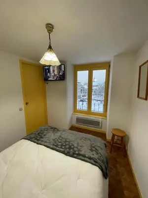 Un ou plusieurs lits dans un hébergement de l'établissement Les Thermes 25 Le Mont Dore