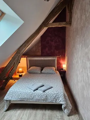 Un ou plusieurs lits dans un hébergement de l'établissement Les Gîtes du Villajou