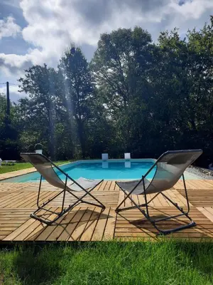 Piscine de l'établissement Gîte en Corrèze 12 pers, Piscine chauffée et Salle de jeux ou située à proximité