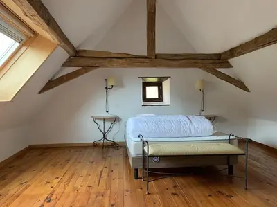 Un ou plusieurs lits dans un hébergement de l'établissement Charmante maison périgourdine