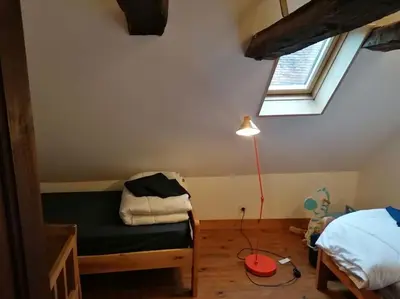 Un ou plusieurs lits dans un hébergement de l'établissement Charmante maison périgourdine