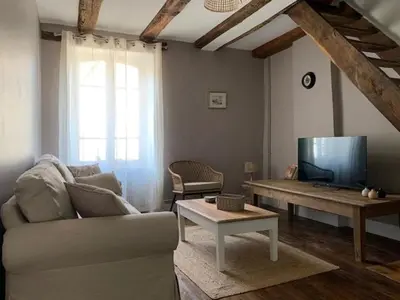 Télévision ou salle de divertissement dans l'établissement L'Authentique maison de charme