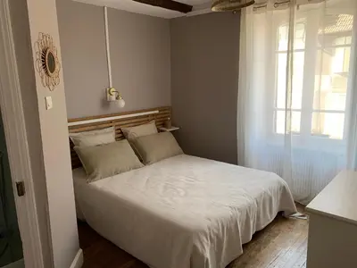 Un ou plusieurs lits dans un hébergement de l'établissement L'Authentique maison de charme