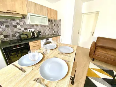 Cuisine ou kitchenette dans l'établissement L'Arlequin, cosy et calme