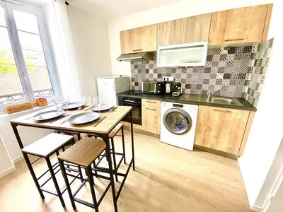Cuisine ou kitchenette dans l'établissement L'Arlequin, cosy et calme