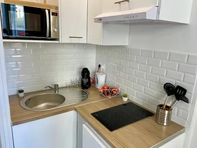 Cuisine ou kitchenette dans l'établissement Les Halles studio unique et cosy