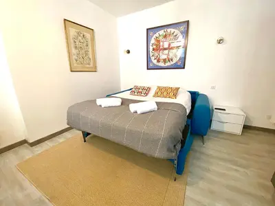 Un ou plusieurs lits dans un hébergement de l'établissement L'Adrien studio tout confort avec terrasse