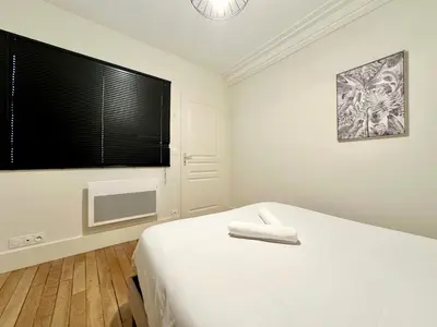 Un ou plusieurs lits dans un hébergement de l'établissement L'Haussmannien, splendide et lumineux