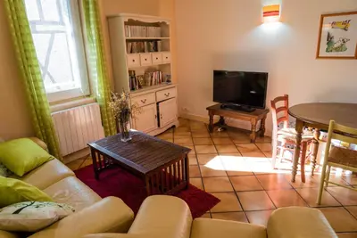 Télévision ou salle de divertissement dans l'établissement Maison agréable en centre historique