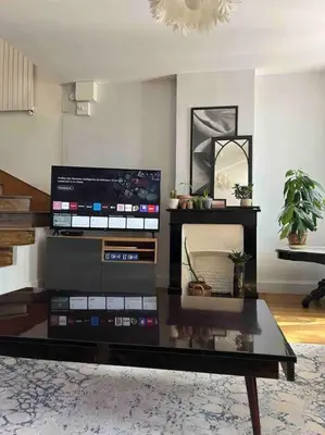Télévision ou salle de divertissement dans l'établissement Duplex de charme en centre ville avec terrasse