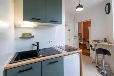 Cuisine ou kitchenette dans l'établissement Le HENDRIX - Studio Hyper Centre
