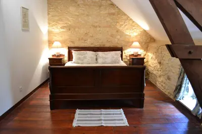 Un ou plusieurs lits dans un hébergement de l'établissement Maison Les Chandelles