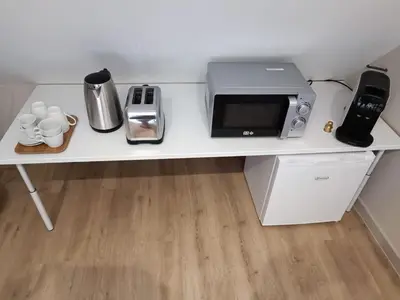 Cuisine ou kitchenette dans l'établissement Suite La Marquise