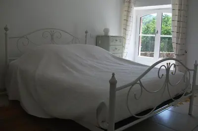 Un ou plusieurs lits dans un hébergement de l'établissement Gîte Les Noyers