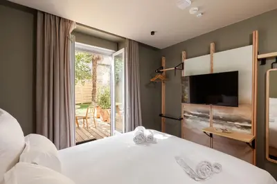 Un ou plusieurs lits dans un hébergement de l'établissement Hôtel Gambettes - Entrée autonome, réception en ligne - Encore Mieux