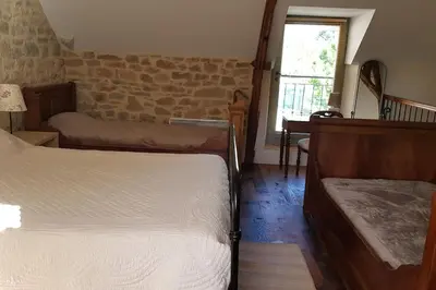 Un ou plusieurs lits dans un hébergement de l'établissement Maison de village avec piscine privative - gite-loubaribas