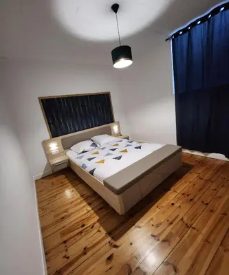 Un ou plusieurs lits dans un hébergement de l'établissement Chaleureux appartement refait à neuf