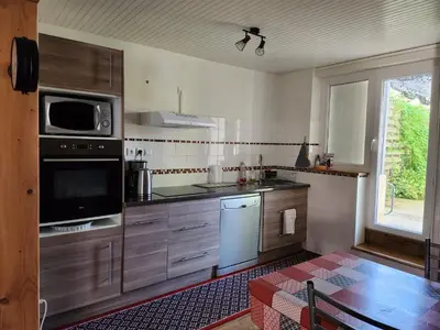 Cuisine ou kitchenette dans l'établissement la maison de Jade