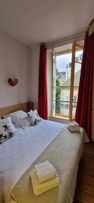 Un ou plusieurs lits dans un hébergement de l'établissement Hotel ChezJeanne