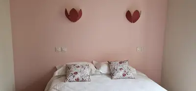 Un ou plusieurs lits dans un hébergement de l'établissement Hotel ChezJeanne