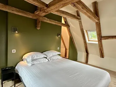 Un ou plusieurs lits dans un hébergement de l'établissement Château de la Borde à Ussel, centre-ville, proche autoroute A89