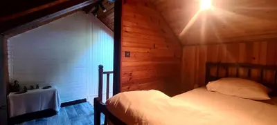 Un ou plusieurs lits dans un hébergement de l'établissement Maisonnette Lac de Vassivière