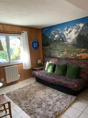 Coin salon dans l'établissement RDC Appartement dans chalet Le Genestou