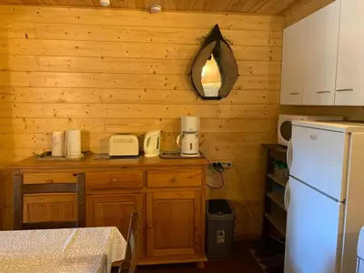 Cuisine ou kitchenette dans l'établissement RDC Appartement dans chalet Le Genestou