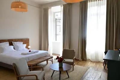 Un ou plusieurs lits dans un hébergement de l'établissement Les Chambres du Cloître