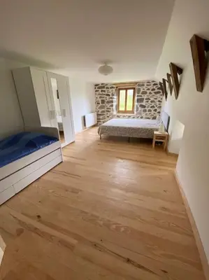 Un ou plusieurs lits dans un hébergement de l'établissement Domaine des Hiboux