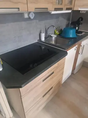 Cuisine ou kitchenette dans l'établissement le Mont dore Centre ville appartement