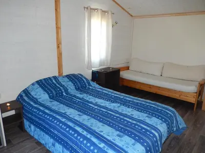 Un ou plusieurs lits dans un hébergement de l'établissement Cottages du Lac de Miel