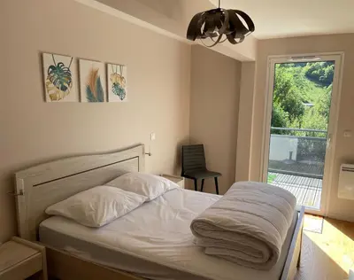 Un ou plusieurs lits dans un hébergement de l'établissement Le B4 - Résidence La Montille - lumineux - parking couvert - wifi