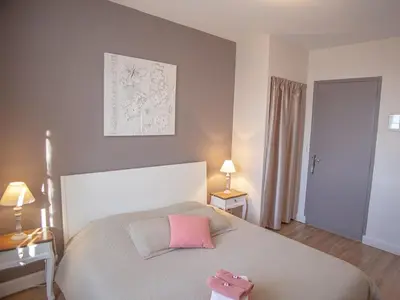 Un ou plusieurs lits dans un hébergement de l'établissement Chambres & Tables d'hôtes Le Pech Grand