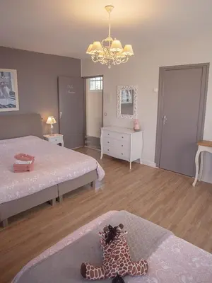 Un ou plusieurs lits dans un hébergement de l'établissement Chambres & Tables d'hôtes Le Pech Grand