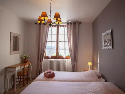 Un ou plusieurs lits dans un hébergement de l'établissement Chambres & Tables d'hôtes Le Pech Grand