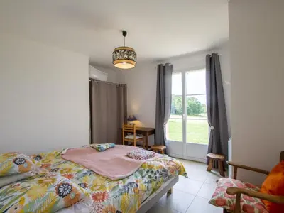 Un ou plusieurs lits dans un hébergement de l'établissement Maison récente avec terrasse et équipements pour enfants en Dordogne - FR-1-616-334