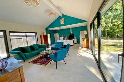Coin salon dans l'établissement Le Cottage proche du Golf