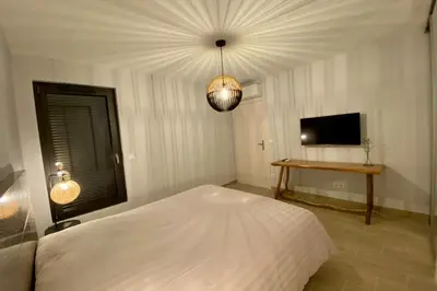 Télévision ou salle de divertissement dans l'établissement Le Cottage proche du Golf