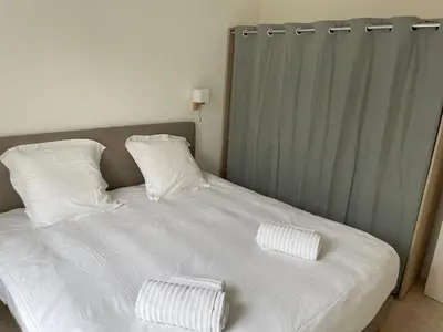 Un ou plusieurs lits dans un hébergement de l'établissement Appartement Suzon en coeur de ville 2 personnes