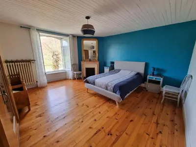 Un ou plusieurs lits dans un hébergement de l'établissement Maison La Rase du Lac Cantal
