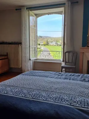 Un ou plusieurs lits dans un hébergement de l'établissement Maison La Rase du Lac Cantal