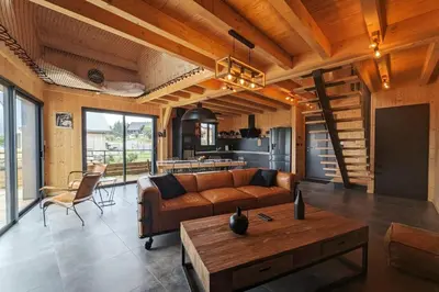 Coin salon dans l'établissement La Flèche 2 - Chalet Standing - Jacuzzi Privatif