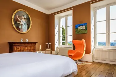 Un ou plusieurs lits dans un hébergement de l'établissement Le petit chateau